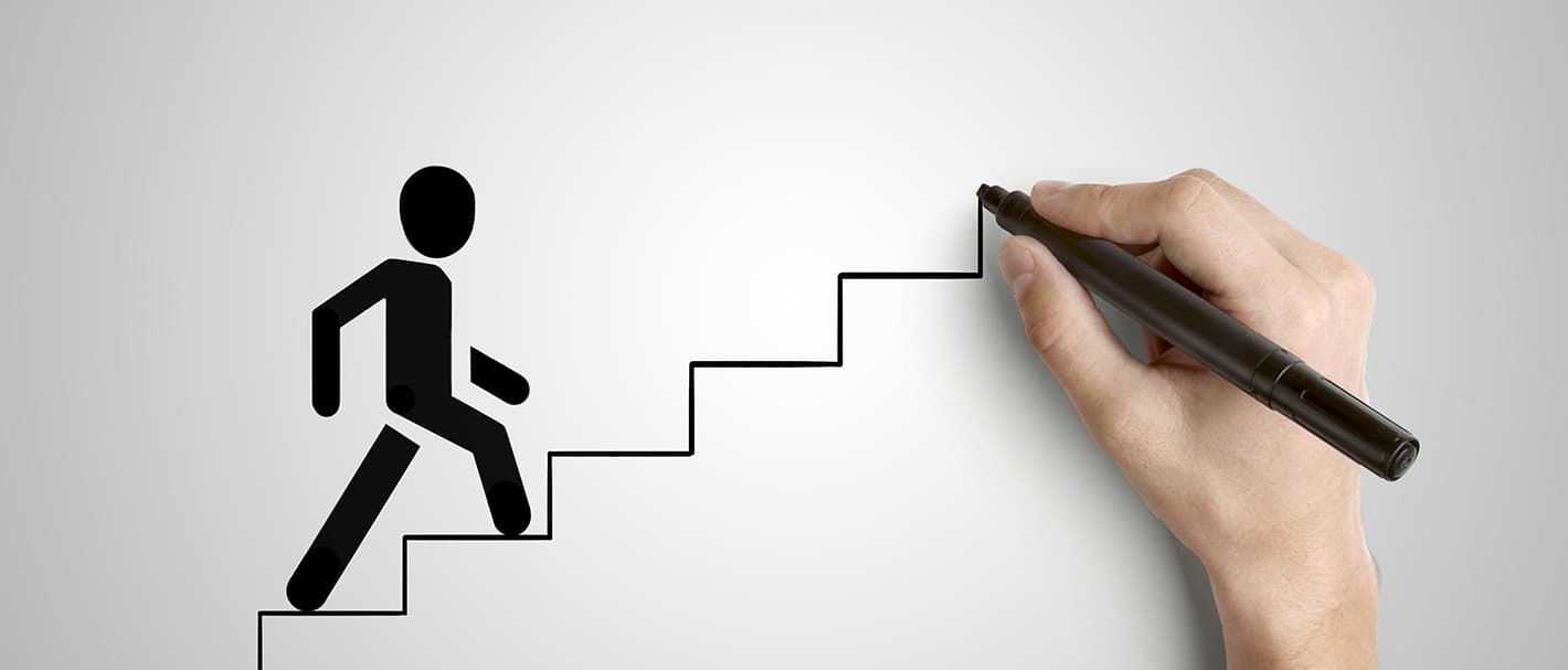 Hand draws a staircase while a stick figure runs up it