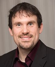 Das Bild zeigt ein Portraitfoto von Michael Kelka.